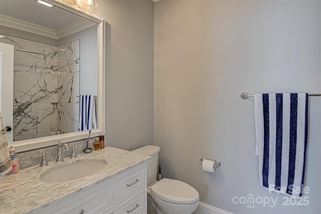 bathroom with ornamental molding, toilet, vanity, and a shower