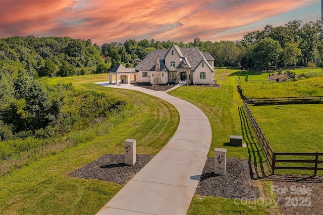 view of property's community with a lawn