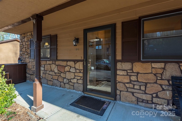 doorway to property with a porch