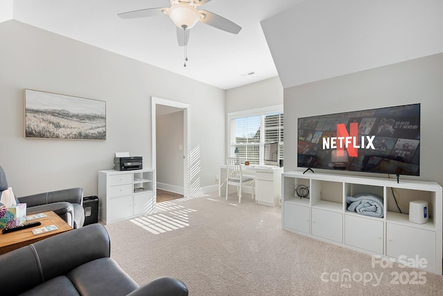 carpeted living room featuring ceiling fan