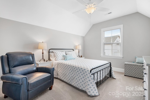 bedroom featuring vaulted ceiling, light colored carpet, and ceiling fan