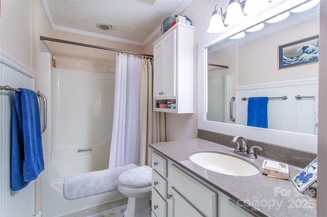 bathroom with toilet, crown molding, and vanity