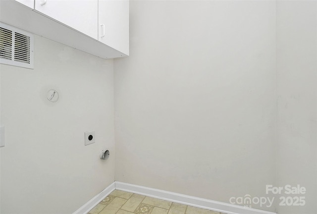 laundry area featuring cabinets and electric dryer hookup