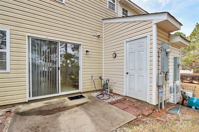 entrance to property with a patio