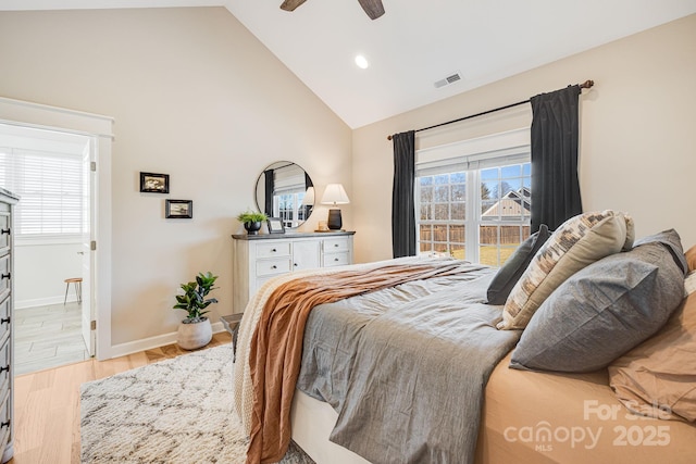 bedroom with multiple windows, high vaulted ceiling, ceiling fan, and light wood-type flooring