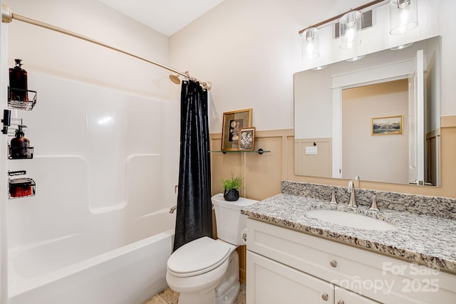 full bathroom featuring vanity, shower / tub combo, and toilet