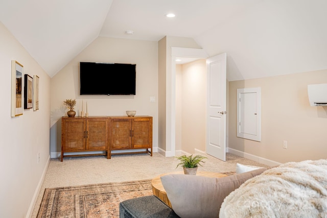 living room with a wall mounted air conditioner, lofted ceiling, and light colored carpet