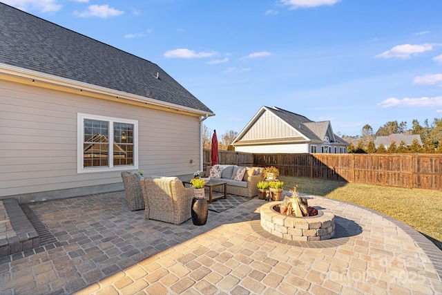 view of patio / terrace featuring an outdoor living space with a fire pit