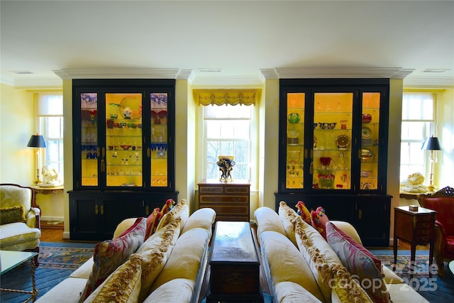 interior space featuring ornamental molding and wood finished floors