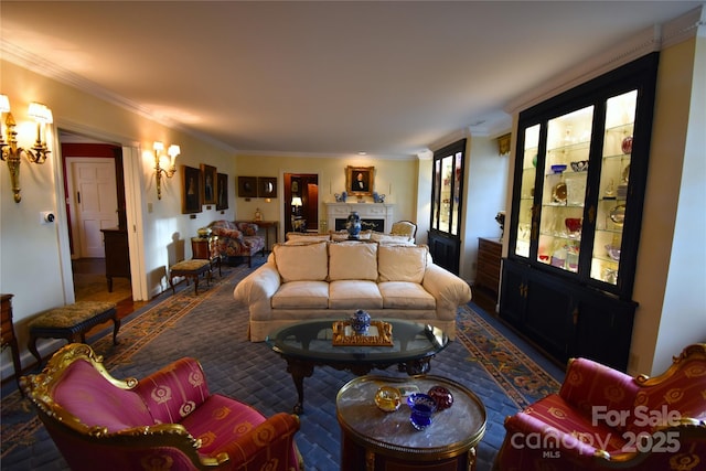 living area featuring ornamental molding and a fireplace