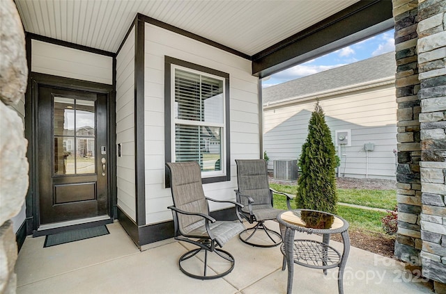 exterior space with central AC and a porch