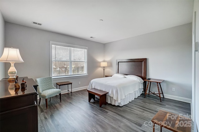 bedroom featuring dark hardwood / wood-style floors