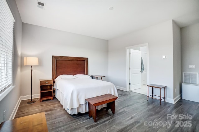 bedroom with dark wood-type flooring