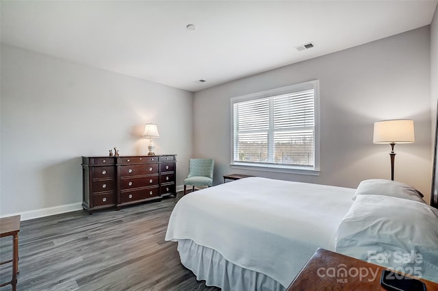 bedroom featuring dark hardwood / wood-style flooring