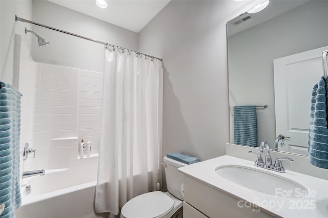 full bathroom featuring vanity, toilet, and shower / bath combo with shower curtain