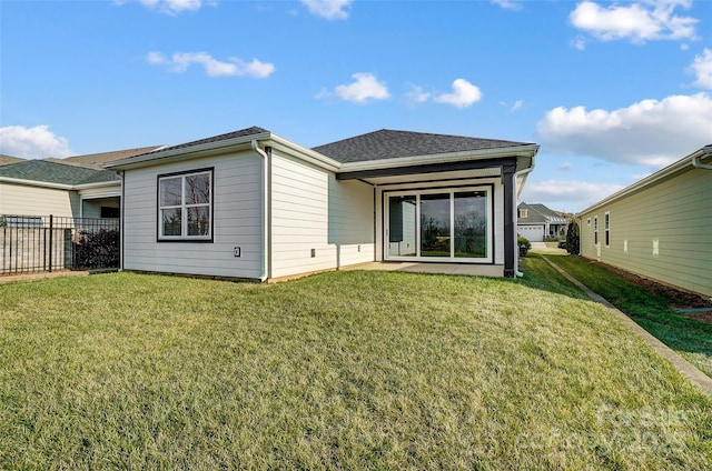 rear view of house with a lawn