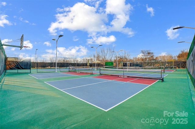 view of sport court featuring basketball hoop