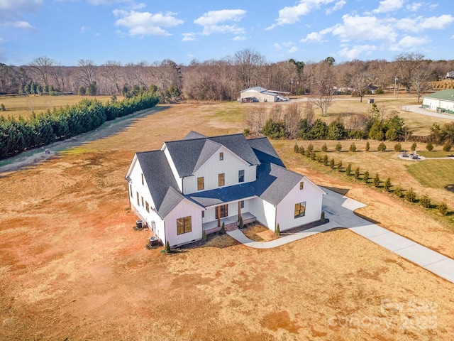 birds eye view of property featuring a rural view