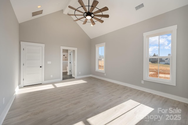 interior space featuring high vaulted ceiling, a wealth of natural light, ceiling fan, and light hardwood / wood-style flooring