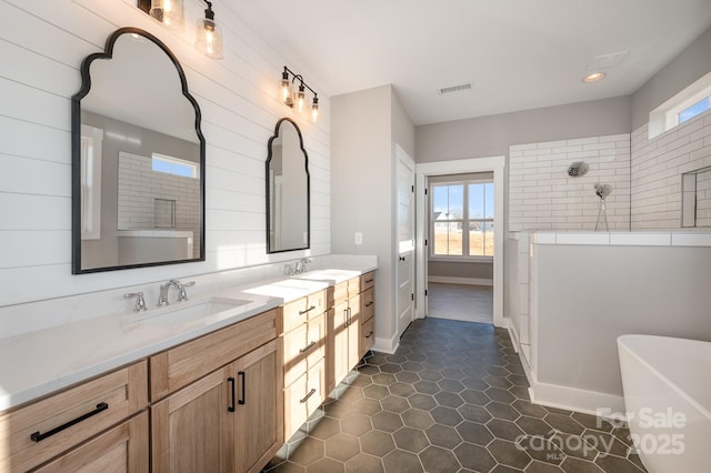 bathroom featuring tile patterned flooring, vanity, and independent shower and bath