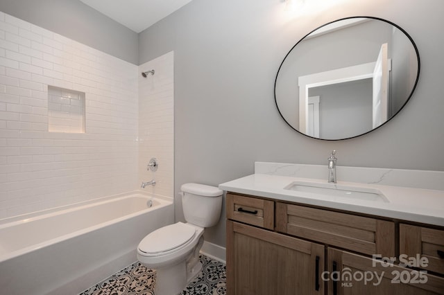 full bathroom featuring tiled shower / bath combo, vanity, tile patterned floors, and toilet