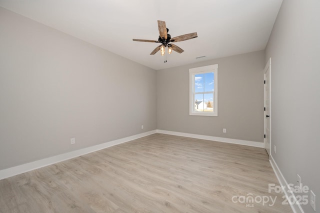 unfurnished room featuring ceiling fan and light hardwood / wood-style flooring