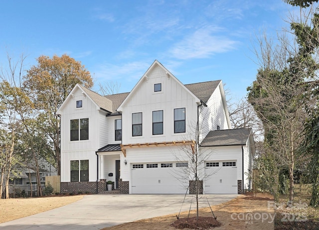 modern inspired farmhouse with a garage