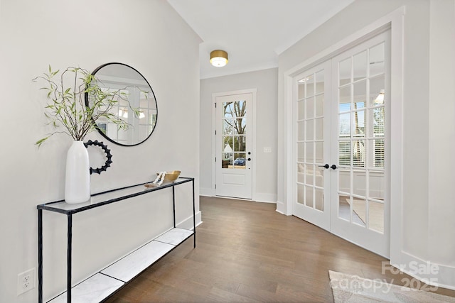 entryway with dark hardwood / wood-style floors and french doors