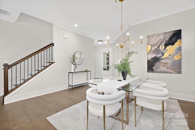 dining space with a notable chandelier, crown molding, and dark hardwood / wood-style floors