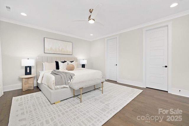 bedroom with crown molding, ceiling fan, and dark hardwood / wood-style flooring