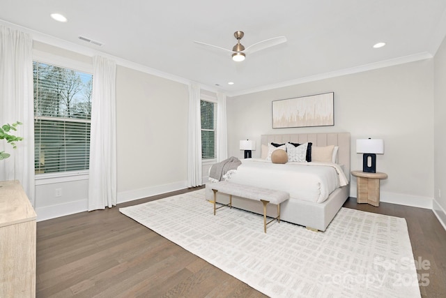 bedroom with ceiling fan, ornamental molding, and dark hardwood / wood-style floors