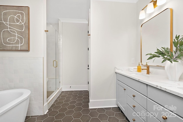 bathroom featuring tile patterned floors, vanity, and separate shower and tub