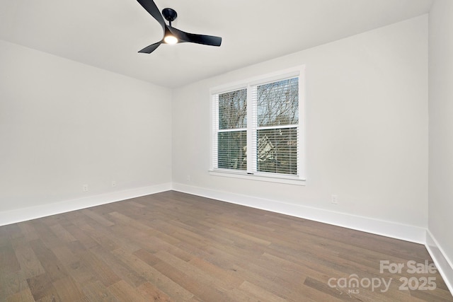 unfurnished room with ceiling fan and wood-type flooring