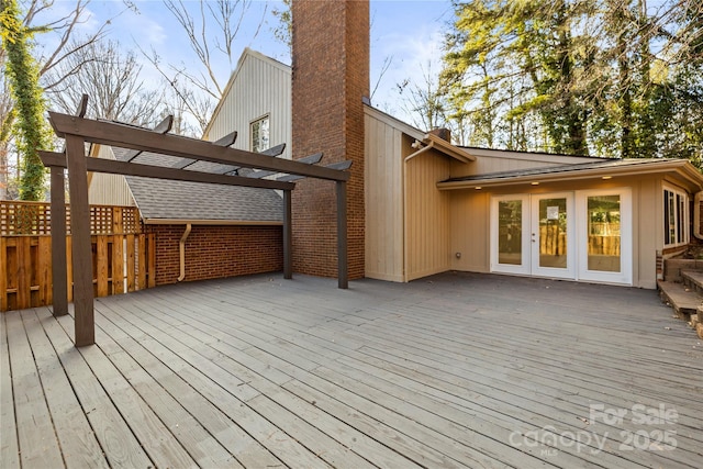 deck with a pergola and french doors