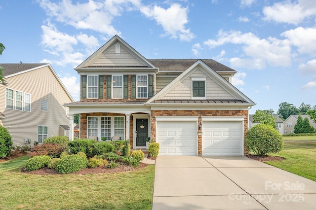 view of front of house with a garage and a front yard