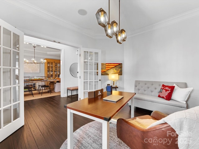 living room with ornamental molding, dark wood-type flooring, a chandelier, and french doors