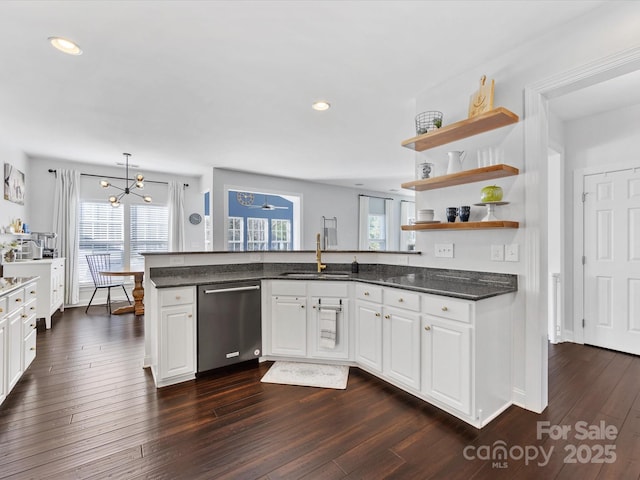 kitchen with white cabinetry, dark hardwood / wood-style floors, dishwasher, and sink