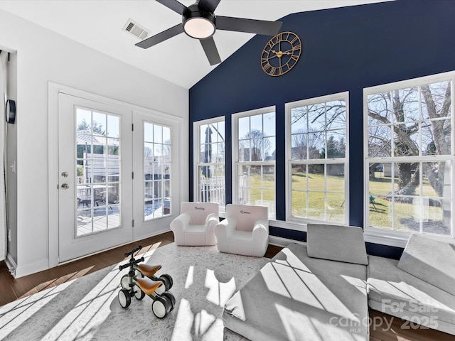 sunroom featuring ceiling fan, plenty of natural light, and lofted ceiling