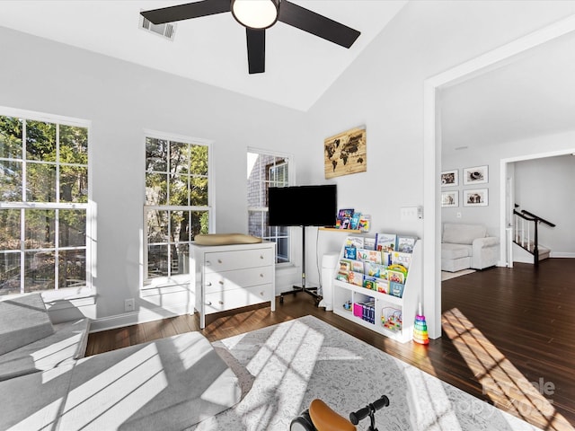 rec room featuring ceiling fan, lofted ceiling, and dark hardwood / wood-style flooring