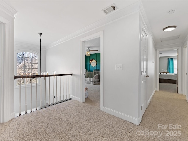 hallway featuring light carpet, a notable chandelier, and crown molding