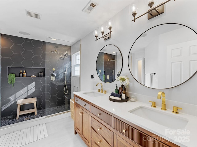 bathroom featuring vanity and a tile shower