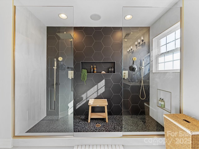 bathroom with a tile shower