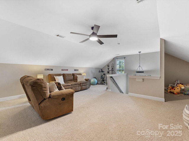 living room with vaulted ceiling, ceiling fan, and carpet