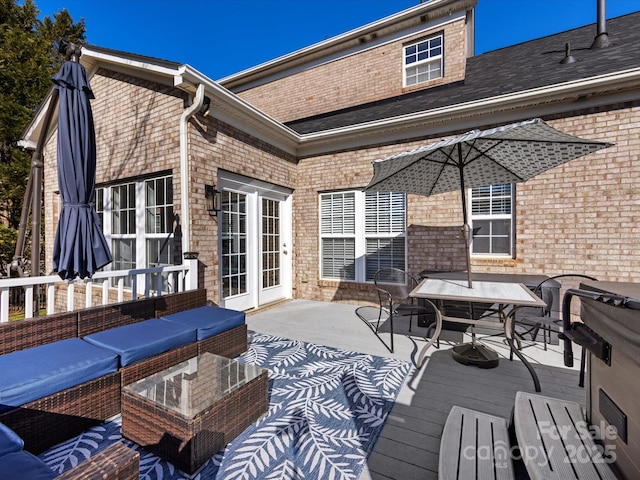 wooden terrace featuring outdoor lounge area