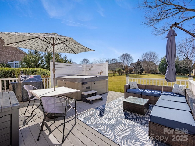 wooden deck featuring a hot tub and an outdoor hangout area