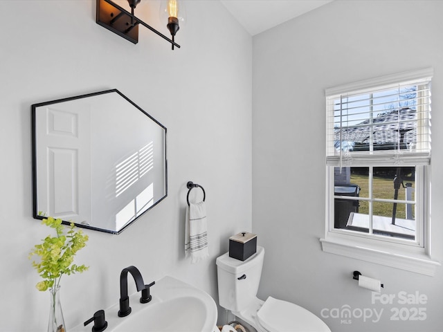 bathroom with sink and toilet