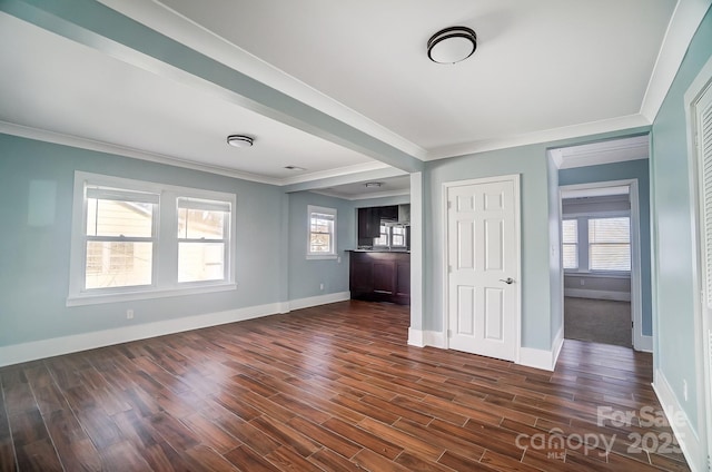 interior space featuring crown molding and dark hardwood / wood-style flooring