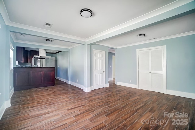 unfurnished living room featuring ornamental molding