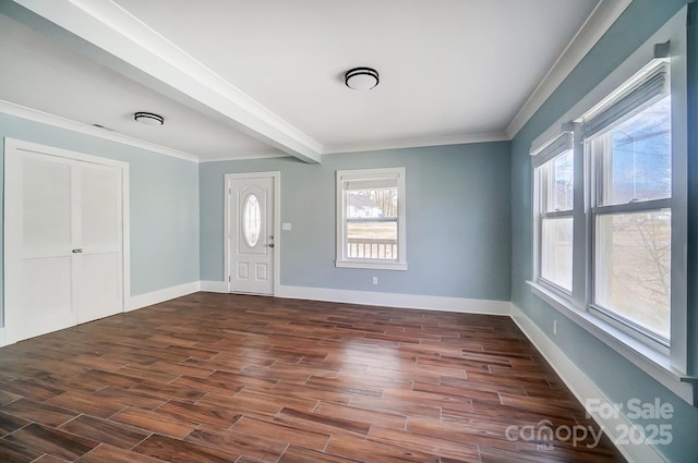 entrance foyer featuring plenty of natural light and ornamental molding