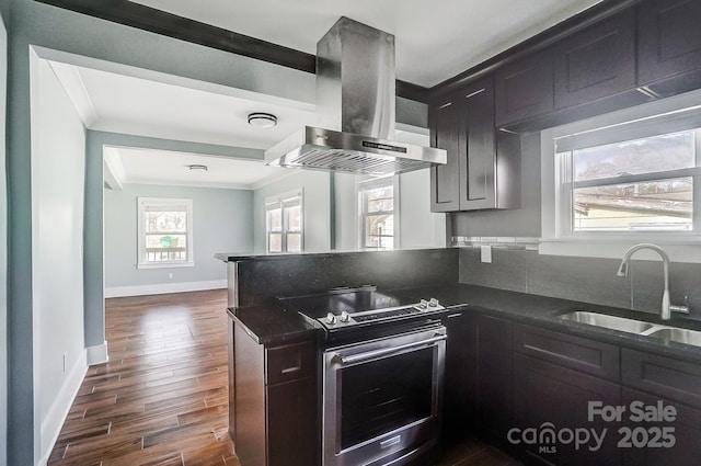 kitchen with sink, crown molding, dark wood-type flooring, stainless steel range with electric stovetop, and island range hood